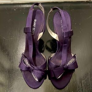 Purple satin rhinestoned dress heels.